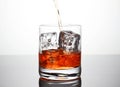 Glass with ice and liquor splash Royalty Free Stock Photo