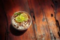 A Glass with ice tea lemon on the table. Royalty Free Stock Photo