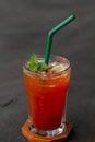 Glass of ice tea with mint and lemon on wooden table Royalty Free Stock Photo