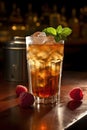 a glass of ice tea with raspberries and mint leaves