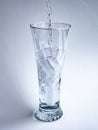 A glass of ice water being filled Royalty Free Stock Photo