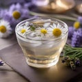 A glass of iced chamomile lavender tea with a chamomile flower and lavender sprig1 Royalty Free Stock Photo