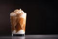 glass of iced coffee latte with swirl of whipped cream and sprinkle of cinnamon Royalty Free Stock Photo