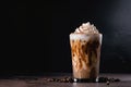 glass of iced coffee latte with swirl of whipped cream and sprinkle of cinnamon Royalty Free Stock Photo