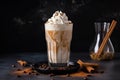 glass of iced coffee latte with swirl of whipped cream and sprinkle of cinnamon Royalty Free Stock Photo