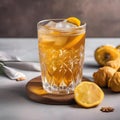 A glass of iced ginger turmeric tea with a ginger slice and turmeric root3 Royalty Free Stock Photo