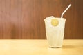Glass of iced honey and lemon on wood table Royalty Free Stock Photo