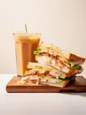 Glass of iced latte and sandwich.