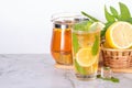 Glass of iced tea with mint and lemon on marble table. Cold drink Royalty Free Stock Photo