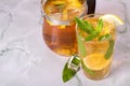 Glass of iced tea with mint and lemon on marble table. Cold drink Royalty Free Stock Photo