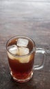 A glass of iced tea on a wooden table. Focus selected Royalty Free Stock Photo