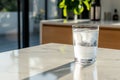 Glass of iced water on marble table in sunlight Royalty Free Stock Photo