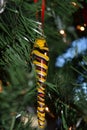 Glass icicle Christmas ornament hanging in tree