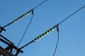 Glass insulators on electric line close-up Royalty Free Stock Photo