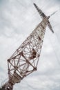 Glass insulators on high voltage power line poles Royalty Free Stock Photo