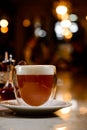 Glass of irish coffee on a table. classic irish coffee saved on a dark bar with a float of heavy cream Royalty Free Stock Photo