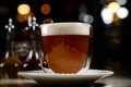 Glass of irish coffee on a table. classic irish coffee saved on a dark bar with a float of heavy cream Royalty Free Stock Photo