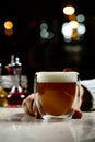 Glass of irish coffee on a table. classic irish coffee saved on a dark bar with a float of heavy cream Royalty Free Stock Photo