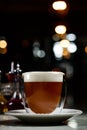 Glass of irish coffee on a table. classic irish coffee saved on a dark bar with a float of heavy cream Royalty Free Stock Photo