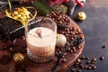 Glass of Irish cream baileys liqueur with ice, roasted coffee beans, cinnamon, Christmas decoration and chocolate on dark wood Royalty Free Stock Photo