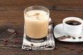 A glass of Irish cream liqueur, a cup of black coffee and coffee beans with chocolate. Royalty Free Stock Photo