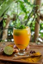 A glass of Jamu `Kunir Asam`, traditional Indonesian herbal tonic medicine