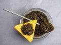 Glass jar with black caviar, and silver spoon, chips. Healthy food. copy space Royalty Free Stock Photo