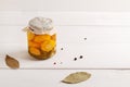 Jar with canned vegetables on white background