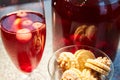 The glass jar of cherry compote, a glass with compote, sweets in a vase, close up Royalty Free Stock Photo