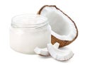 Glass jar of coconut oil and fresh coconut halve and pieces on white background