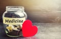 Glass jar with coins and the inscription `Medicine`. The concept of family medicine insurance, healthcare. Medical expenses. Distr Royalty Free Stock Photo