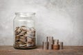 Glass jar with coins.