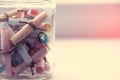 Glass jar with colored notes with blur Royalty Free Stock Photo