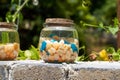 A glass jar with colored stones Royalty Free Stock Photo