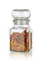 Glass jar with dried chili peppers clove isolated