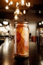 Glass jar with dried citruses on a wooden bar counter