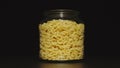 Glass jar with elbow macaroni Royalty Free Stock Photo