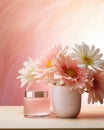 Glass jar of face cream stands on white table next to vase with large bouquet blossoming gerberas on pink background Royalty Free Stock Photo