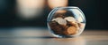 A glass jar filled with coins Royalty Free Stock Photo