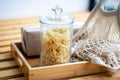 Glass jar filled with dry macarons. Yellow penne pasta Royalty Free Stock Photo