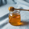 The honey s smooth viscous texture contrasts with the matte fabric Royalty Free Stock Photo