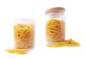 Glass jar filled with penne pasta isolated Royalty Free Stock Photo
