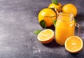 Glass jar of fresh orange juice with fresh fruits Royalty Free Stock Photo