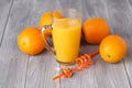 Glass jar of fresh orange juice with fresh fruits on dark table Royalty Free Stock Photo