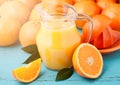 Glass jar of fresh orange juice with fruits Royalty Free Stock Photo