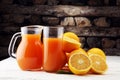 Glass jar of fresh orange juice with fresh fruits on white table Royalty Free Stock Photo