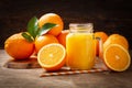 Glass jar of fresh orange juice with fresh fruits Royalty Free Stock Photo