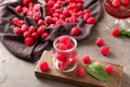 Glass jar with fresh ripe raspberries on table Royalty Free Stock Photo