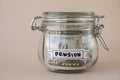 Glass jar full of American currency dollars cash banknote with text PENSION. Preparation saving money. Moderate Royalty Free Stock Photo