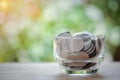 A glass jar full coins with copy space for text, saving money concept, home, loan, education Royalty Free Stock Photo